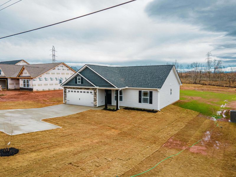 Representative exterior photo of a completed home built from the Saxon by Enchanted Homes in Huckleberry Cove, Chesnee, SC (Image 21). Representative exterior photo of a completed home built from the Saxon by Enchanted Homes in Huckleberry Cove, Chesnee, SC (Image 21).