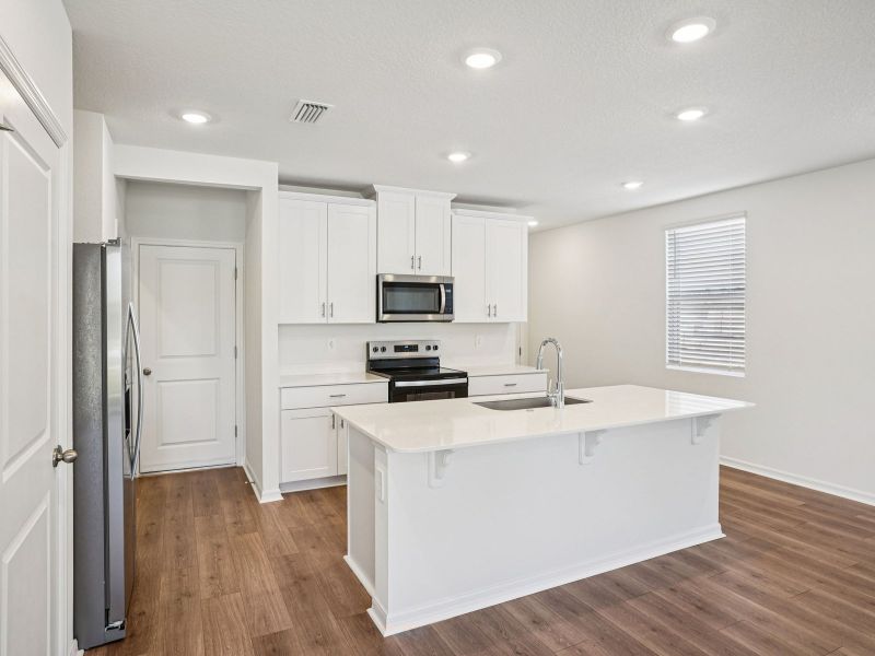 Furnished interior view inside a new home in The Meadow at Crossprairie Townes, St. Cloud (Image 3).