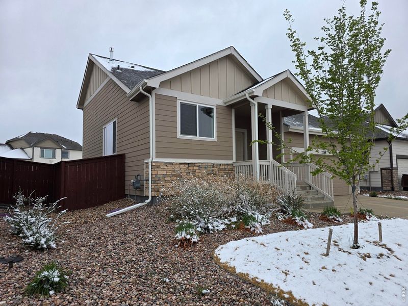 Front exterior of a new home in , Windsor, CO, highlighting curb appeal (Image 14).