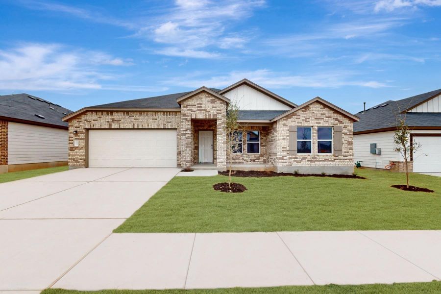 Front exterior of a new home in Carillon, Manor, TX, highlighting curb appeal (Image 1). Front exterior of a new home in Carillon, Manor, TX, highlighting curb appeal (Image 1).