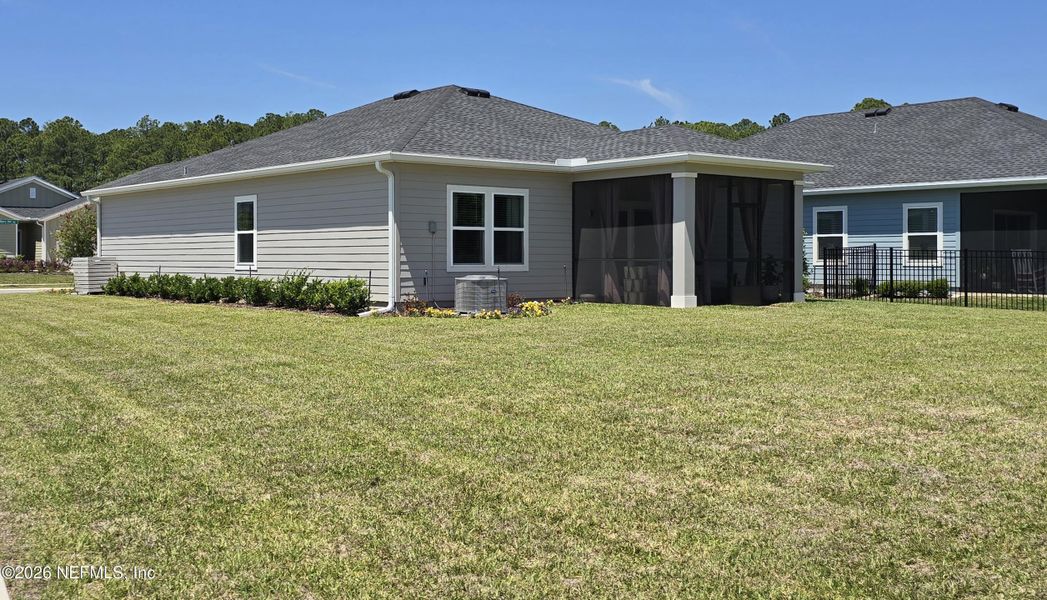 Exterior details and patio area of a home in Edenbrooke at Hyland Trail | 55+, Green Cove Springs (Image 23).