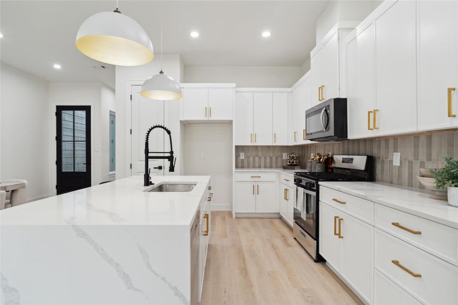 e modern convenience in this newly appointed kitchen, featuring brand-new stainless steel appliances that elevate your culinary adventures.