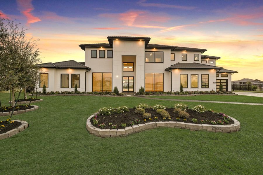 Elegant two-story modern home with clean lines, expansive windows and a beautifully landscaped front yard creating a refined, welcoming presence Elegant two-story modern home with clean lines, expansive windows and a beautifully landscaped front yard creating a refined, welcoming presence