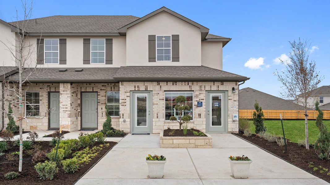 Front exterior of a new home in Palomino, Manor, TX, highlighting curb appeal (Image 20).