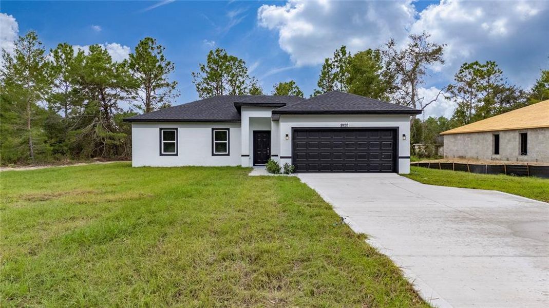 Front exterior of a new home in , Ocala, FL, highlighting curb appeal (Image 28).