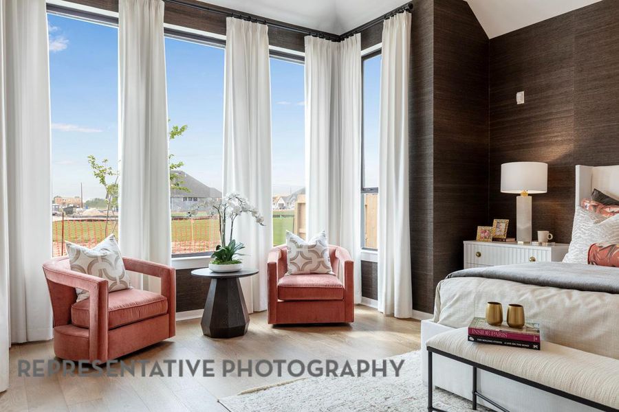 Bedroom featuring wood finished floors and access to outside Bedroom featuring wood finished floors and access to outside