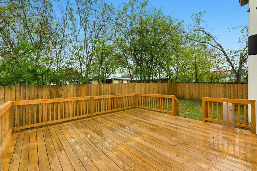 Wooden deck featuring a fenced backyard Wooden deck featuring a fenced backyard