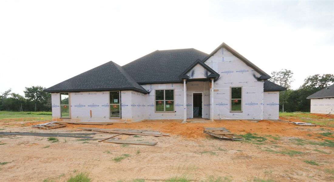 Front exterior of a new home in , Tyler, TX, highlighting curb appeal (Image 1).