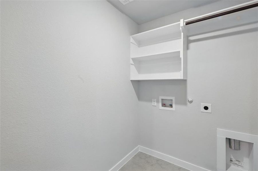 Washroom featuring electric dryer hookup, gas dryer hookup, hookup for a washing machine, and light carpet Washroom featuring electric dryer hookup, gas dryer hookup, hookup for a washing machine, and light carpet