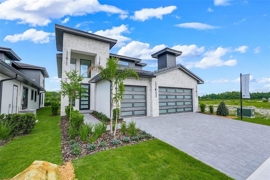 Front exterior of a new home in Hampton Green at Providence, Davenport, FL, highlighting curb appeal (Image 28).