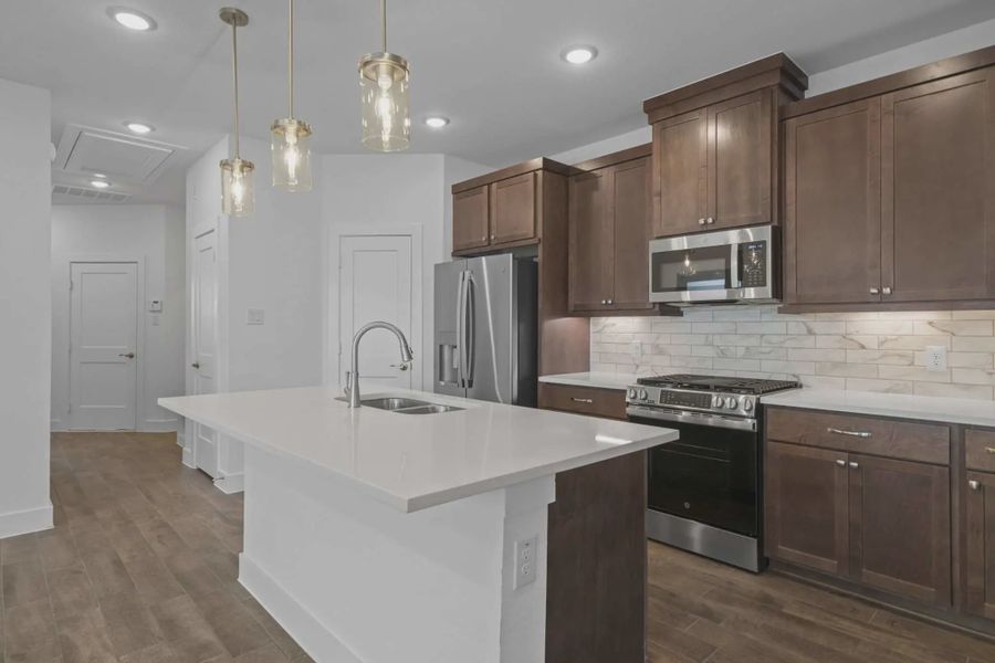 Representative furnished interior of a home built from the Carriagehouse by Chesmar Homes in Meridiana Townhomes, Iowa Colony (Image 52).