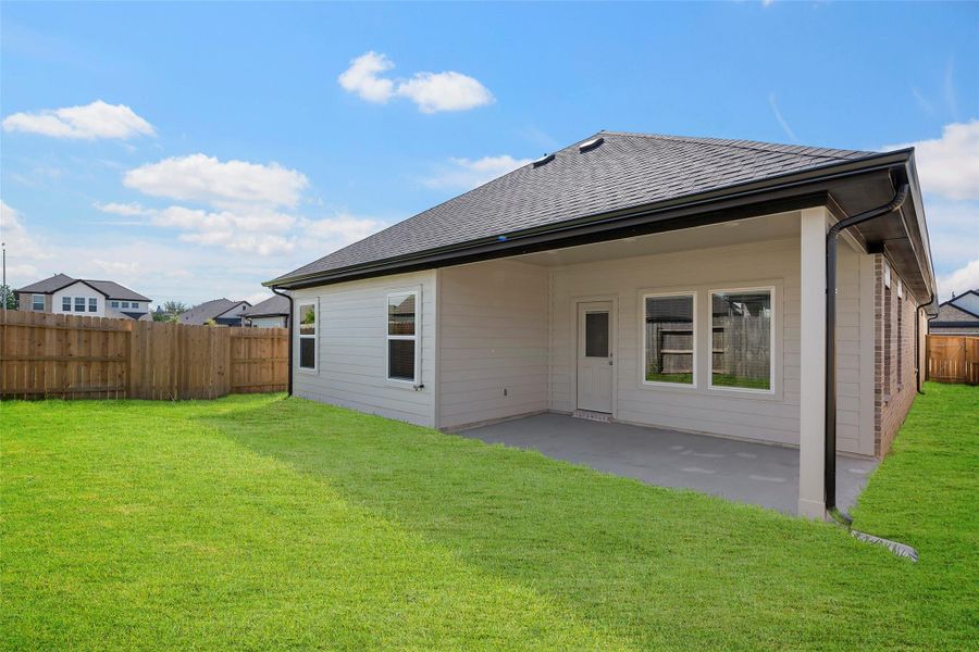 Large backyard offering room for outdoor dining, play, or future upgrades.