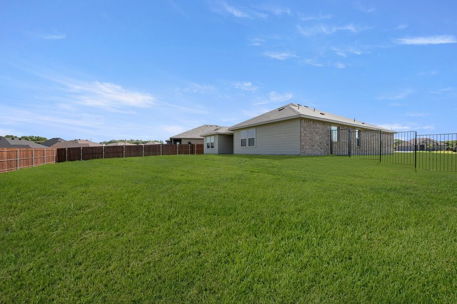 Front exterior of a new home in Mountain Valley Lake, Burleson, TX, highlighting curb appeal (Image 26).