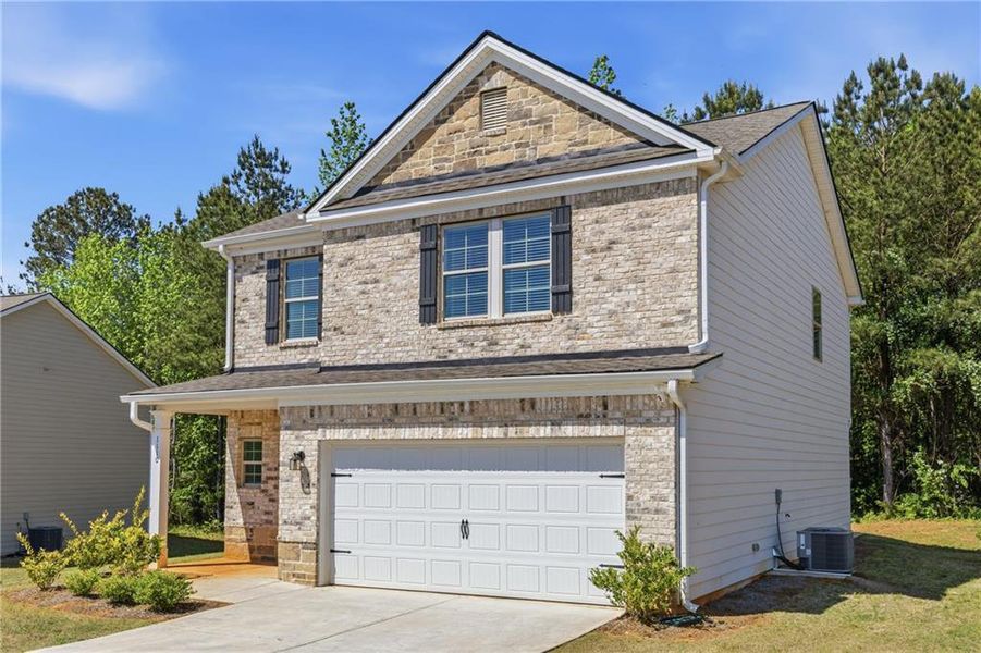 Front exterior of a new home in , Griffin, GA, highlighting curb appeal (Image 25).