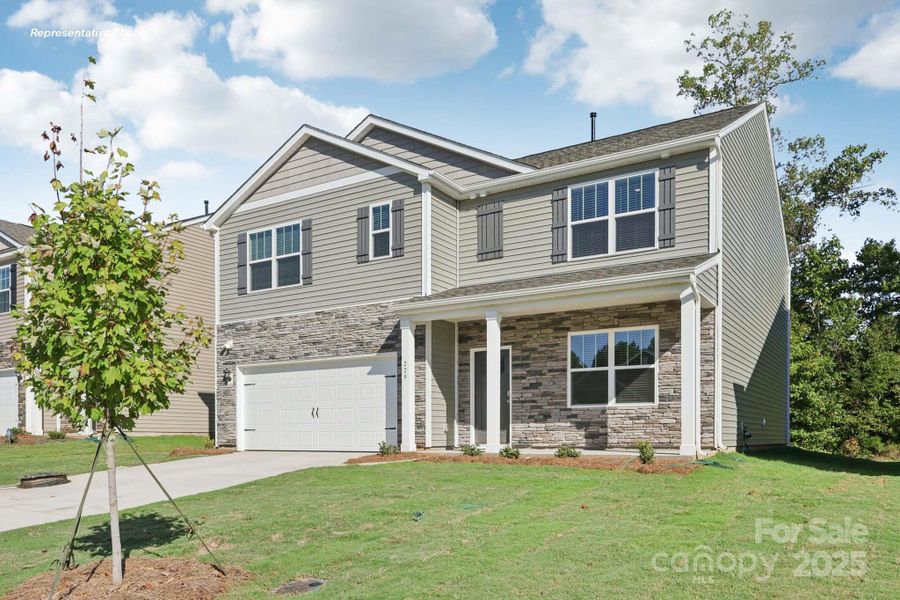 Exterior details and patio area of a home in The Falls at Newton, Newton (Image 1).