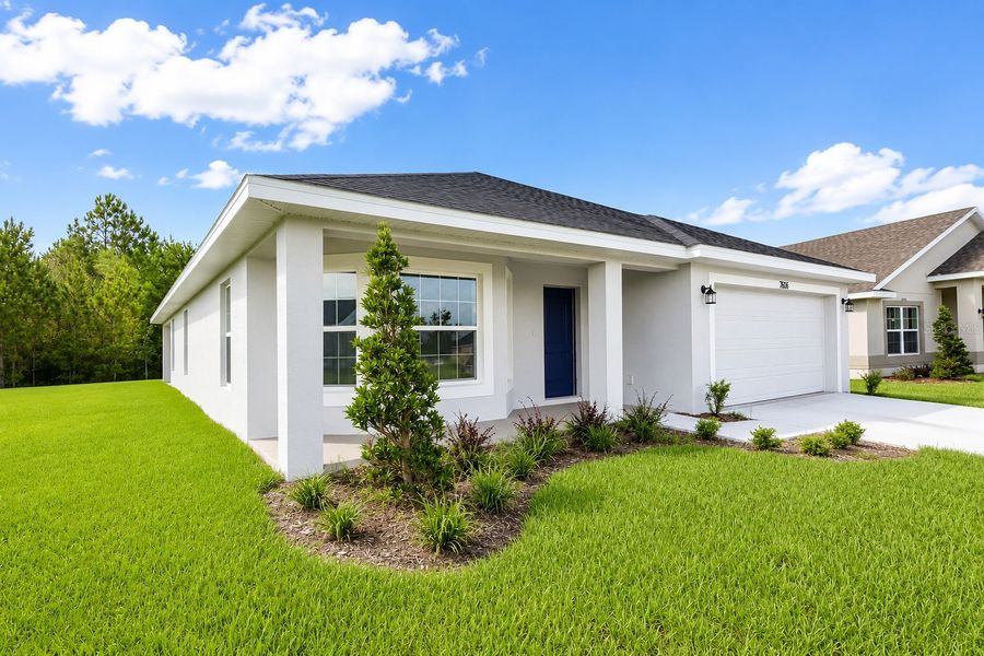 Front exterior of a new home in Harmony Central, St. Cloud, FL, highlighting curb appeal (Image 21).