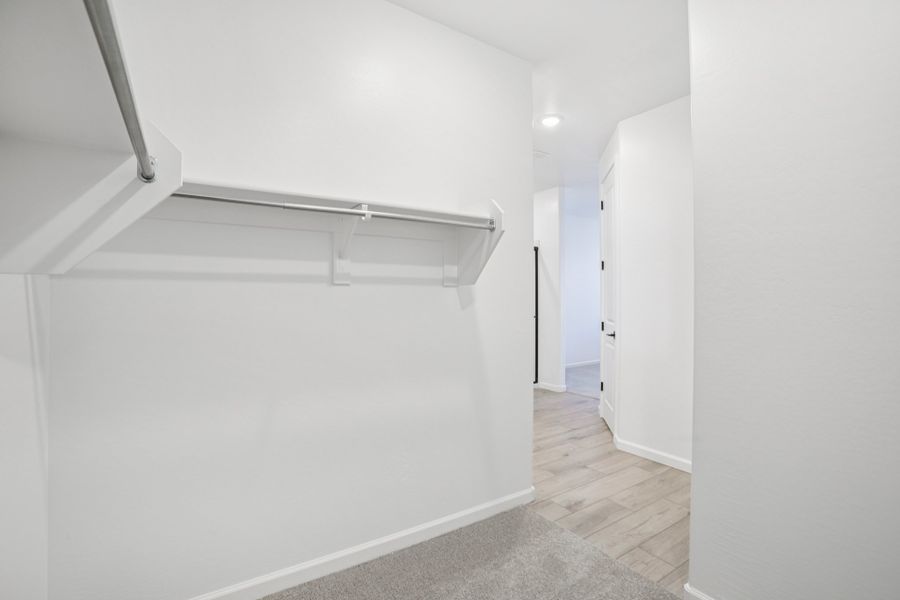 Primary walk in closet. Finishes and options may vary by community