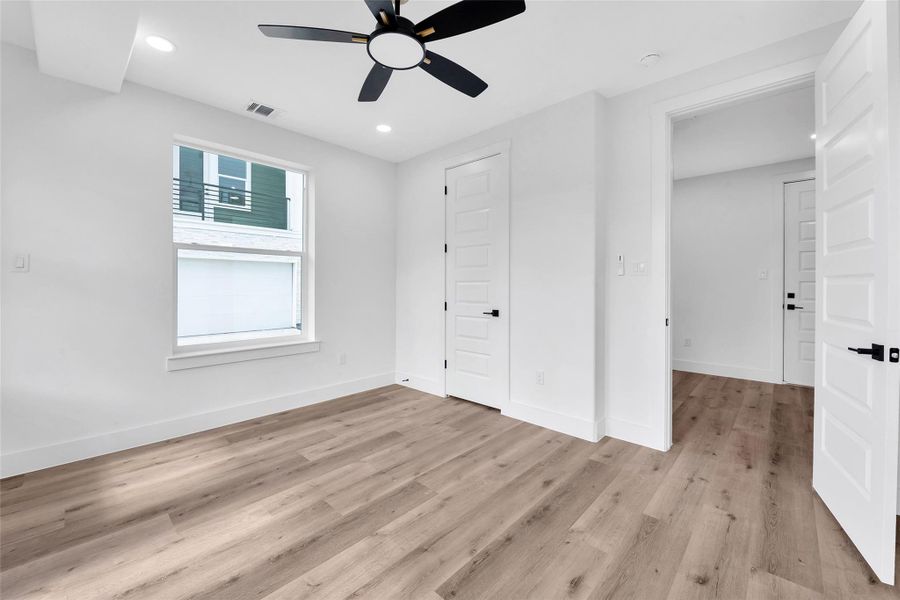 Another view of the first floor bedroom. The window in the room brings in ample natural light.