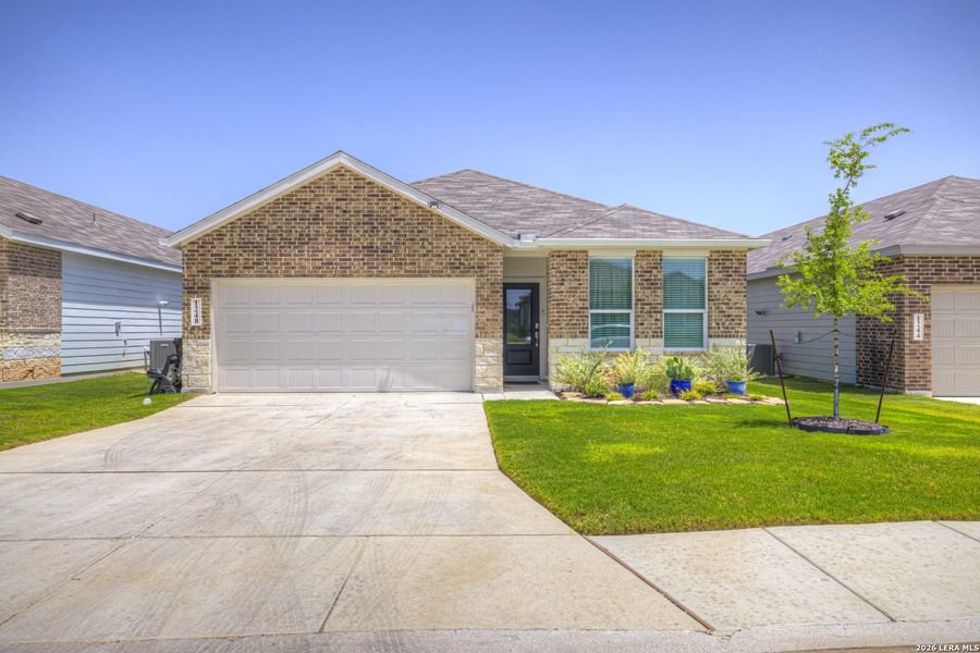 Front exterior of a new home in Parkside, New Braunfels, TX, highlighting curb appeal (Image 2).