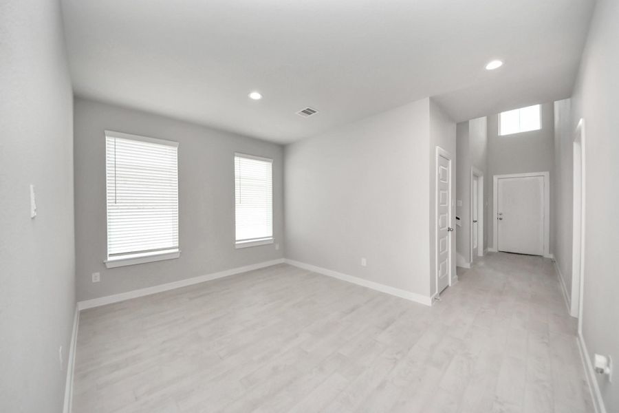 Create lasting memories with your family and friends at the dining table! This expansive dining room showcases sophisticated flooring, custom paint, and seamlessly connects to the family room and kitchen, providing an open and inviting atmosphere. Sample photo of completed home with similar floor plan. Actual colors and selections may vary. Create lasting memories with your family and friends at the dining table! This expansive dining room showcases sophisticated flooring, custom paint, and seamlessly connects to the family room and kitchen, providing an open and inviting atmosphere. Sample photo of completed home with similar floor plan. Actual colors and selections may vary.