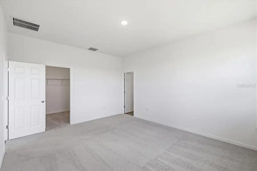 Spacious, unfurnished interior of a new home in Highfield at Twisted Oaks, Wildwood (Image 12).