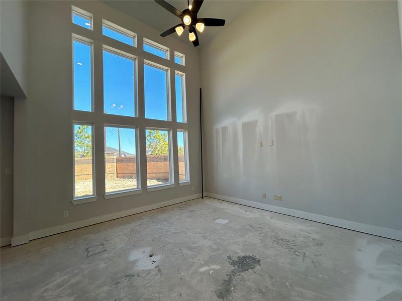 The empty living room feels quiet and open, waiting to be filled with life.