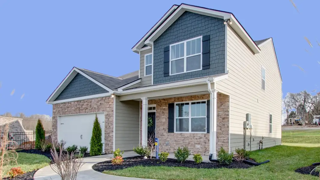 Front exterior of a new home in The Parks, White House, TN, highlighting curb appeal (Image 1).