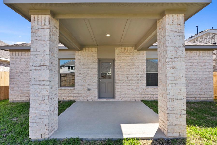 Exterior details and patio area of a home in Windrose Green, Angleton (Image 3).