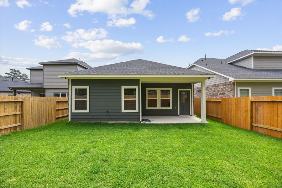 Exterior details and patio area of a home in Mill Creek Trails, Magnolia (Image 3).
