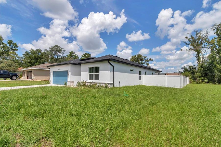 Front exterior of a new home in , Summerfield, FL, highlighting curb appeal (Image 24).