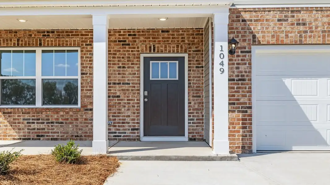 Exterior details and patio area of a home in Hunters Ridge, Woodruff (Image 3).