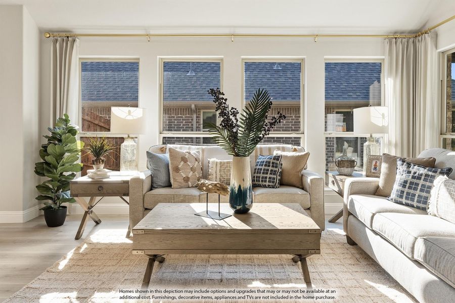 Bright living room with beige sofas, wood coffee table, and large windows with natural light Bright living room with beige sofas, wood coffee table, and large windows with natural light