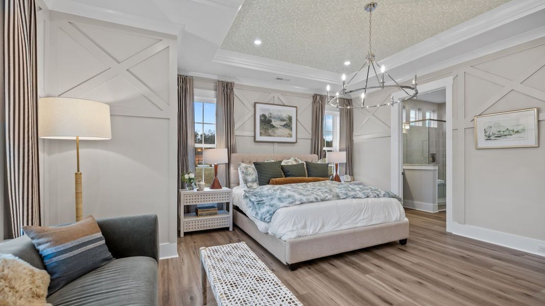 The Inspire Plan by DBR Homes spacious primary suite with coffered ceilings in Fort Mill, SC.