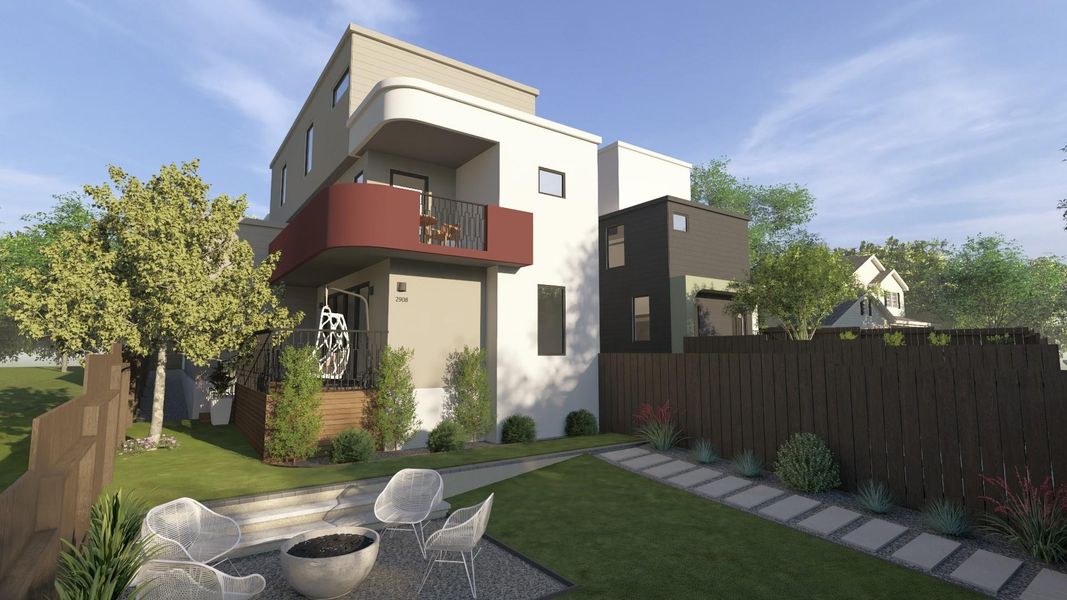 Back of property with a balcony and stucco siding