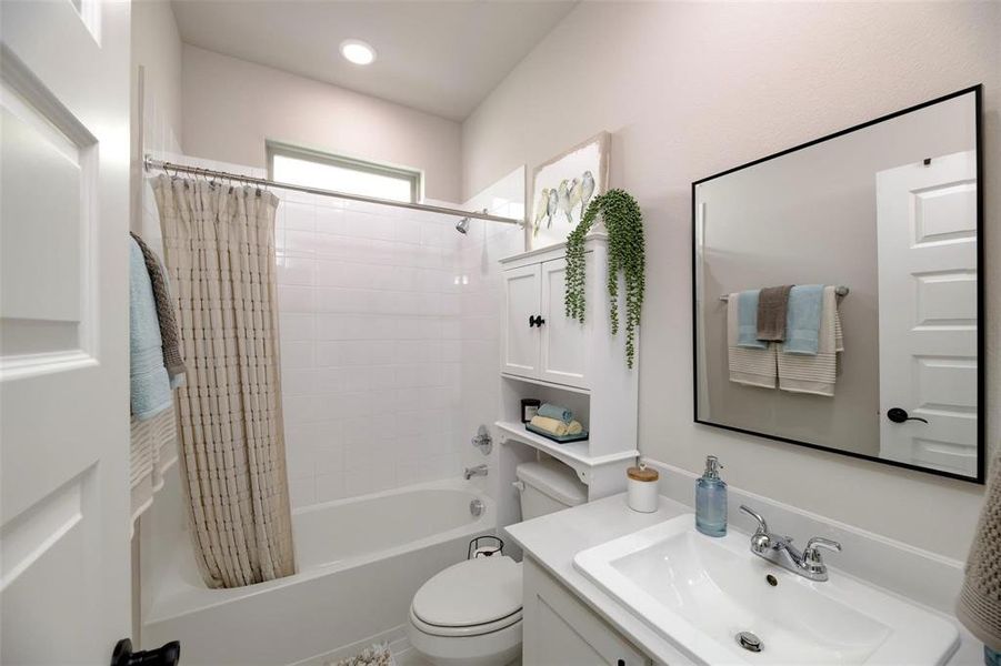 Full bath featuring shower / bath combo and vanity Full bath featuring shower / bath combo and vanity
