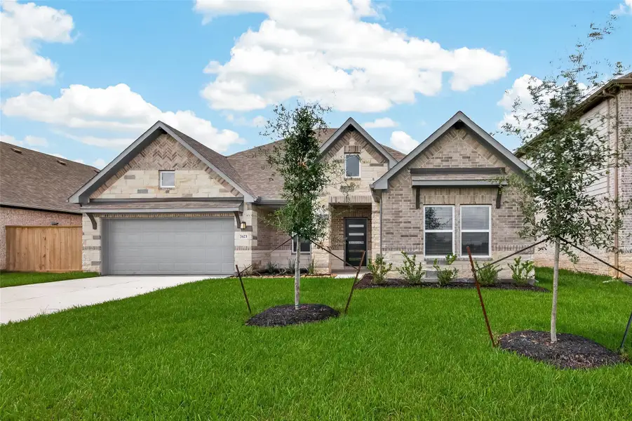 Front exterior of a new home in Foxtail Palms, Manvel, TX, highlighting curb appeal (Image 2). Front exterior of a new home in Foxtail Palms, Manvel, TX, highlighting curb appeal (Image 2).