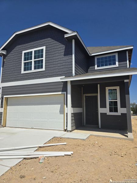 Front exterior of a new home in Abbott Place, St. Hedwig, TX, highlighting curb appeal (Image 21).