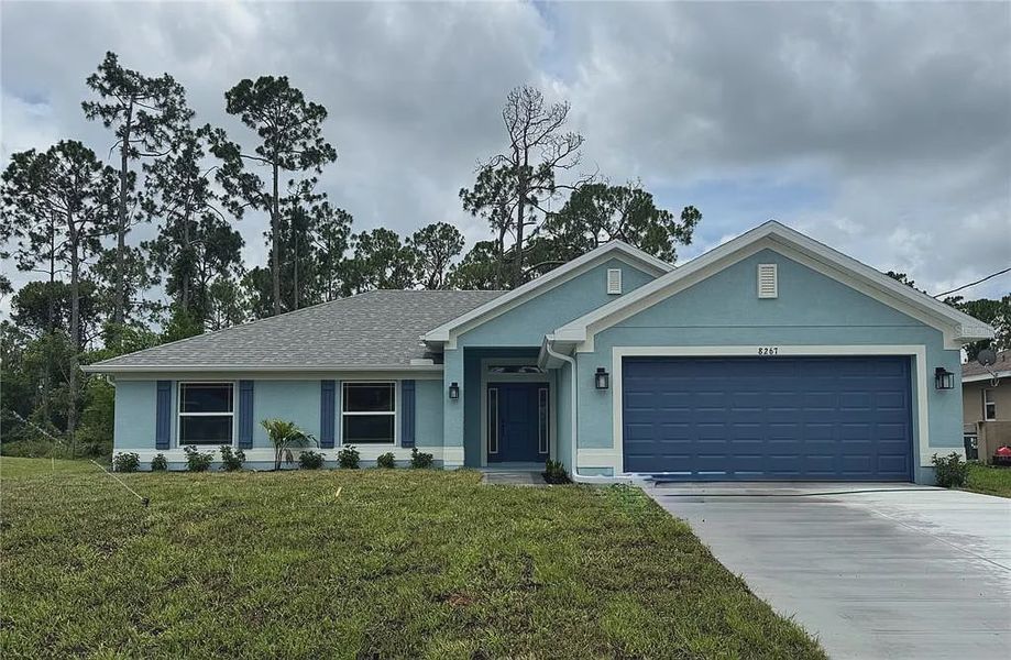 Front exterior of a new home in North Port, North Port, FL, highlighting curb appeal (Image 1). Front exterior of a new home in North Port, North Port, FL, highlighting curb appeal (Image 1).