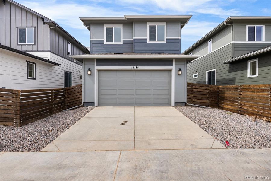 Exterior details and patio area of a home in Barefoot Village, Firestone (Image 21).