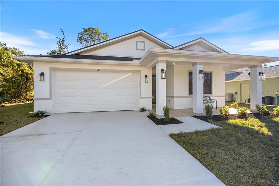 Front exterior of a new home in , Rotonda West, FL, highlighting curb appeal (Image 20).