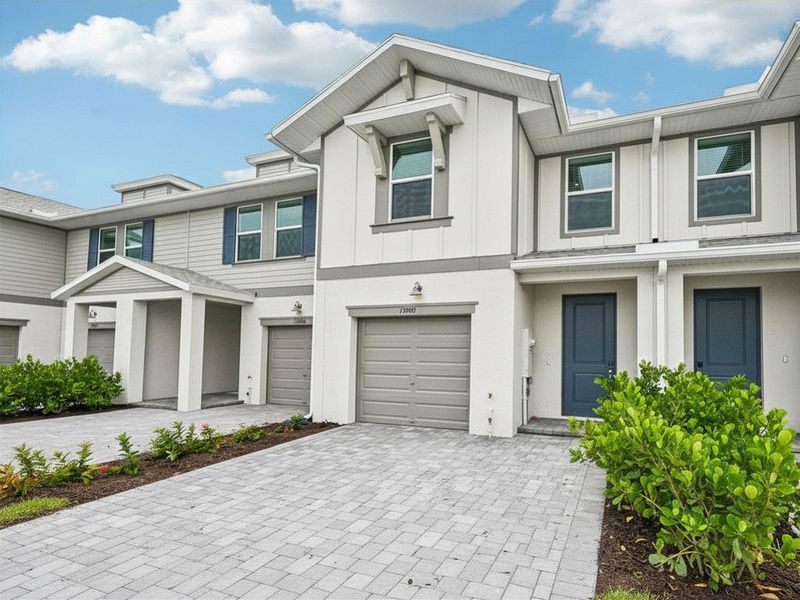 Front exterior of a new home in Meritage Homes at Central Park, Port St. Lucie, FL, highlighting curb appeal (Image 16). Front exterior of a new home in Meritage Homes at Central Park, Port St. Lucie, FL, highlighting curb appeal (Image 16).