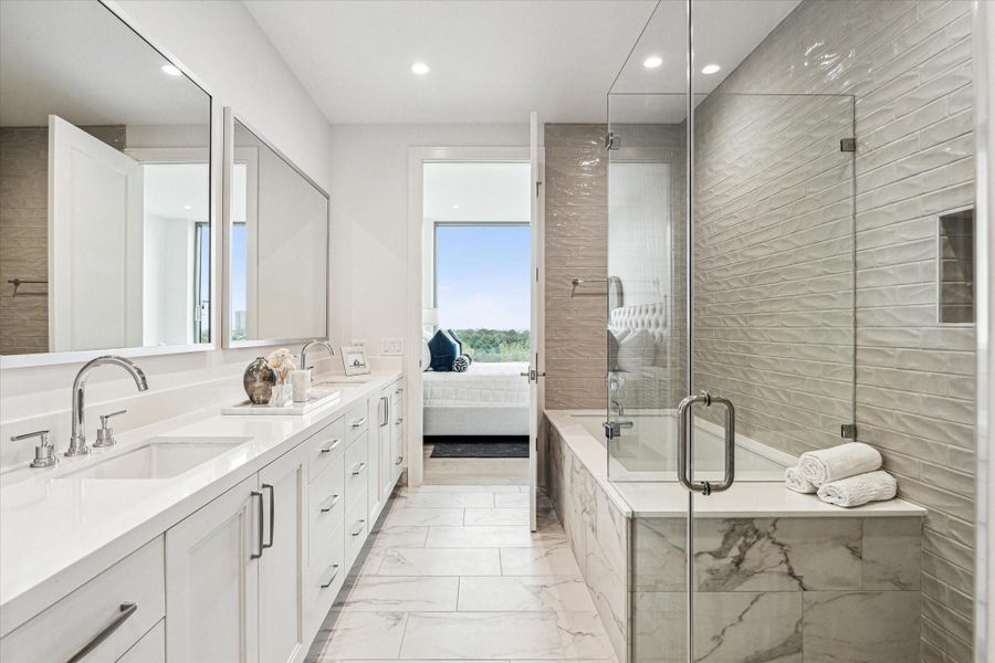 Alternate view of the primary bathroom. Photos are of a similar unit with the same floor plan