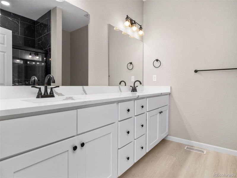 Primary bath with double sink quartz vanity Primary bath with double sink quartz vanity