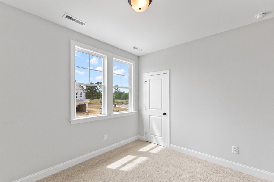 Representative unfurnished interior of a home built from the The Hemlock by RobuckHomes in Kennebec Crossing, Angier (Image 156).