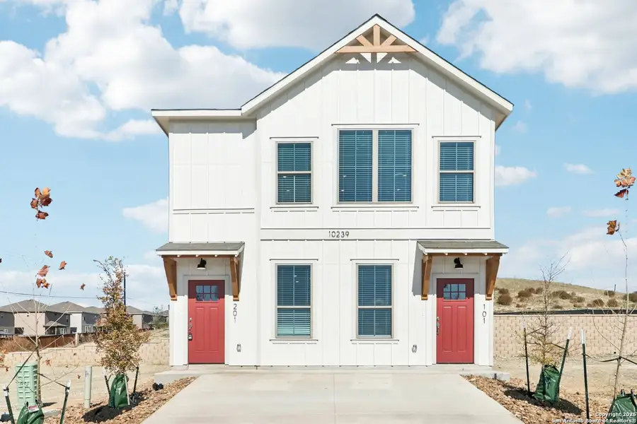 Front exterior of a new home in Magnolia Village, San Antonio, TX, highlighting curb appeal (Image 1). Front exterior of a new home in Magnolia Village, San Antonio, TX, highlighting curb appeal (Image 1).