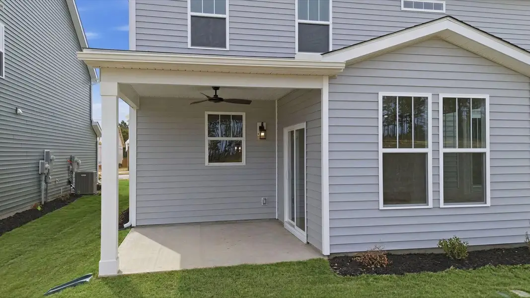 Exclusive rear covered porch with accomplished detail and elevated outdoor living potential at Foxbank