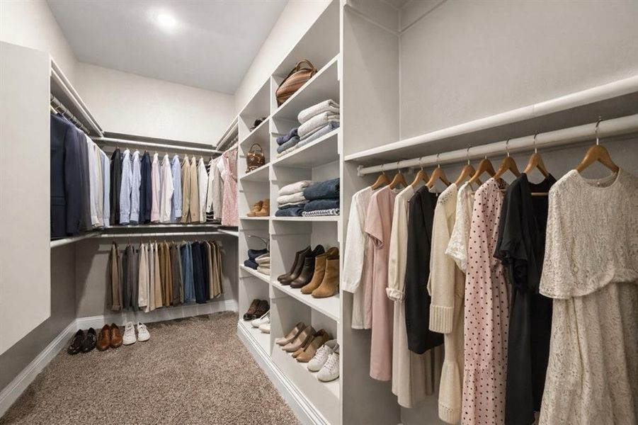 Walk in closet with dark carpet