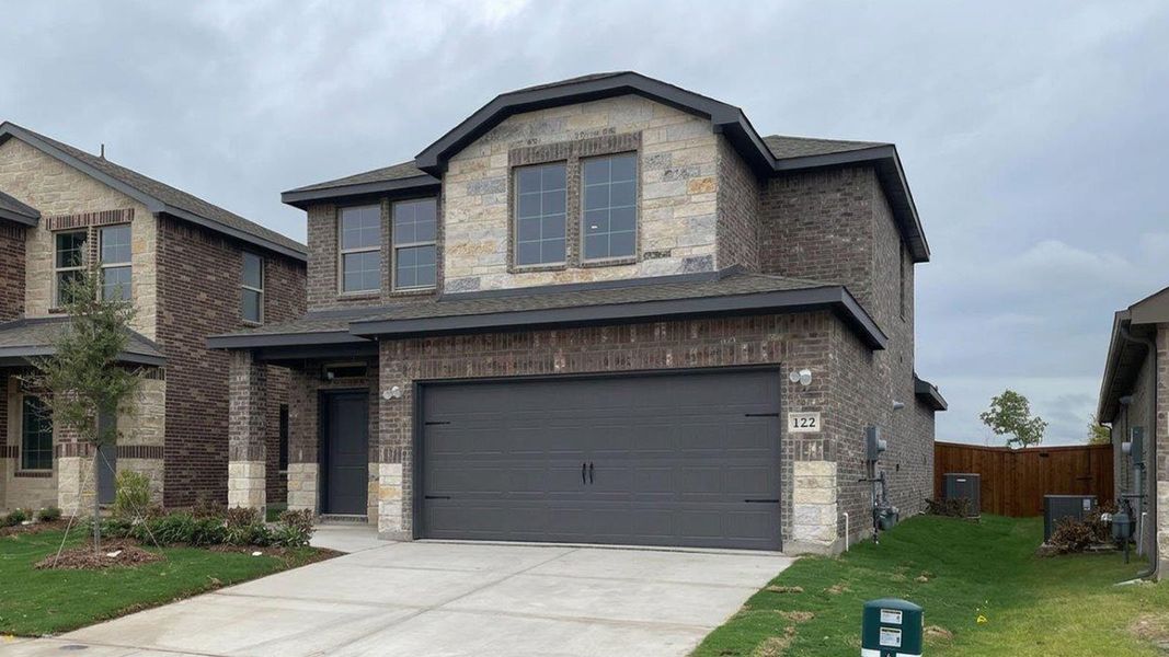Front exterior of a new home in Northspur, Terrell, TX, highlighting curb appeal (Image 1). Front exterior of a new home in Northspur, Terrell, TX, highlighting curb appeal (Image 1).