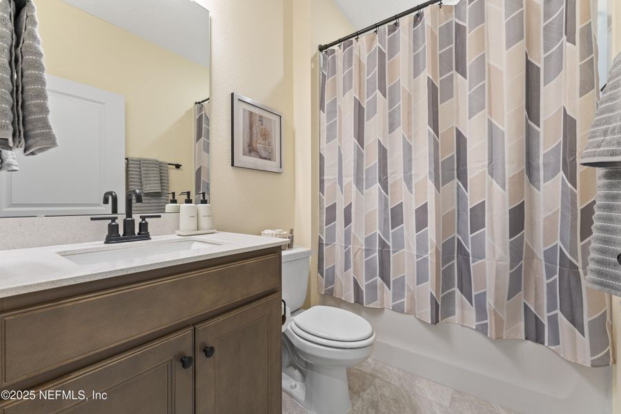 Furnished interior view inside a new home in Summer Bay at Grand Oaks, St. Augustine (Image 33).