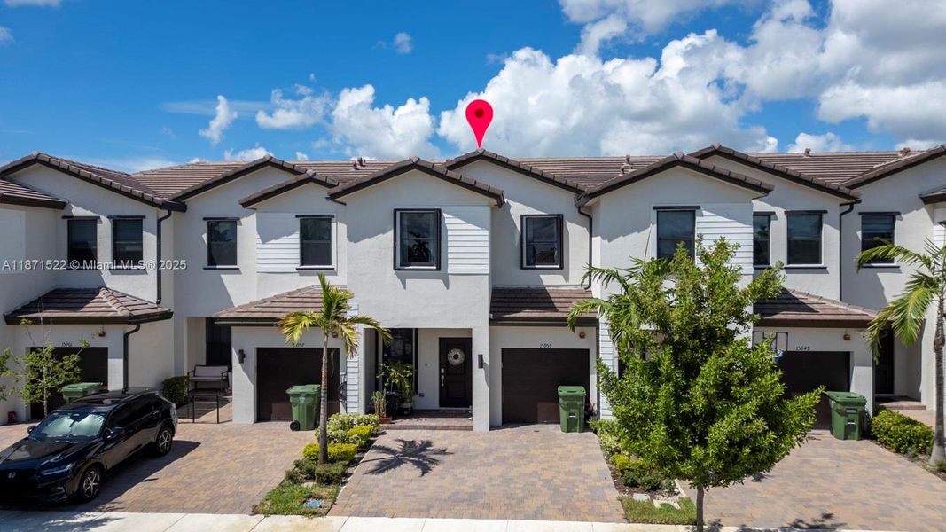 Front exterior of a new home in , Pembroke Pines, FL, highlighting curb appeal (Image 2).